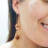 Copper goldstone earrings worn