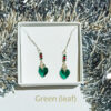 Green Swarovski heart earrings with leaf bale