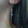 Silver-plated Swarovski drop earrings worn