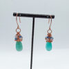 Amazonite cluster earrings hanging off a prop