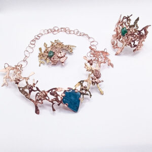 Forest collection - big necklace made with brass and copper, with a large Apatite stone in the middle, and bird, leave and flower elements in copper clay sporting cubic zirconia stones, brooch made with the same materials and an Aventurine stone in the middle, and a bangle, again with the same materials, with a Malachite stone